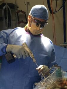 Dr David Edis performing robotic spine surgery