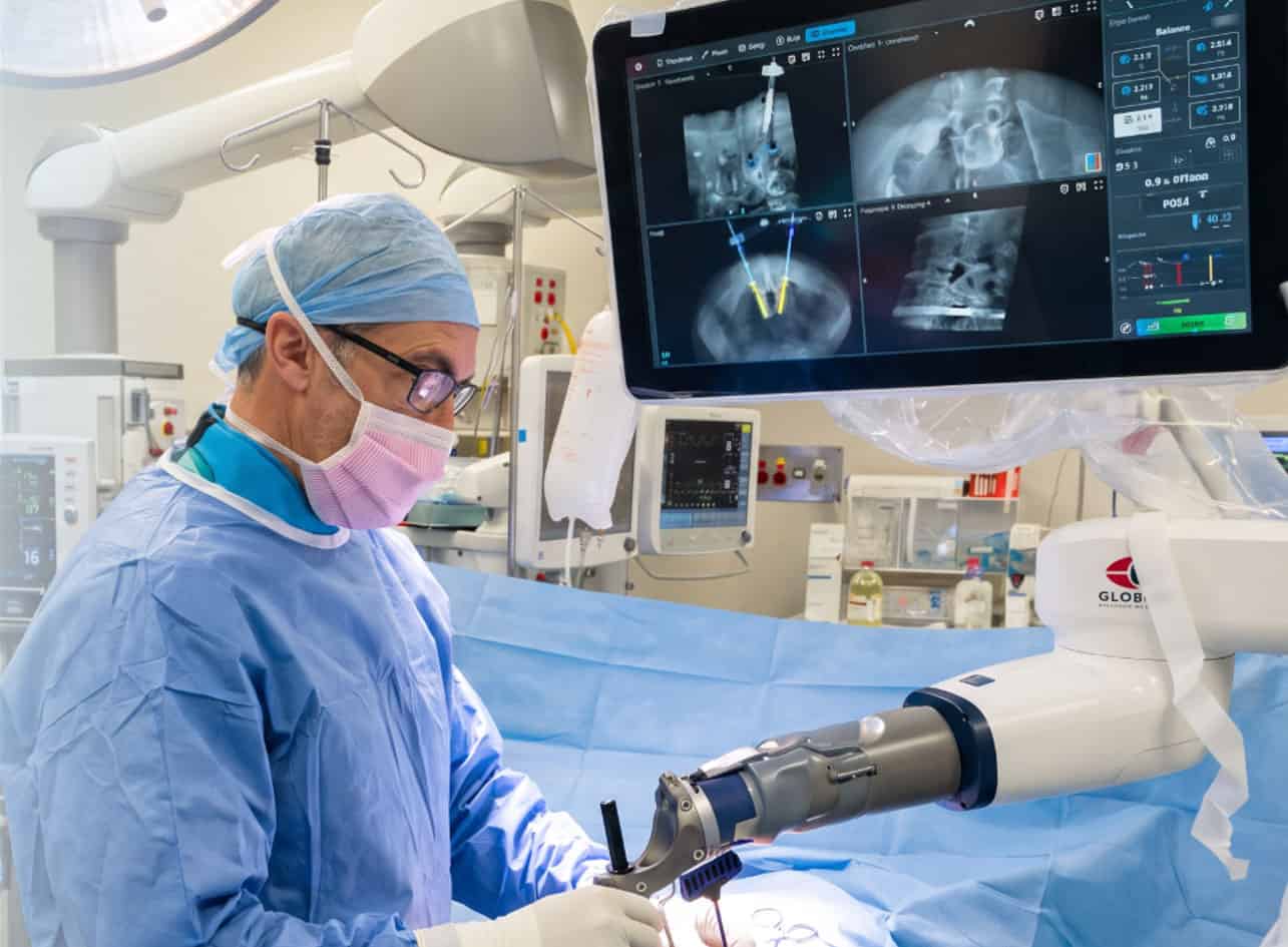 Dr David Edis using robotic navigation technology during spine surgery